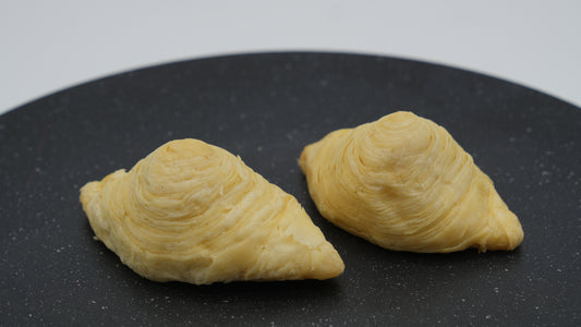 Classic Azerbaijani Badambura – crescent-shaped pastry filled with crushed almonds and sugar, tender texture and traditional design.